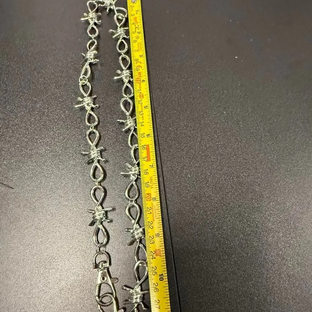 Source Unknown silver barbed